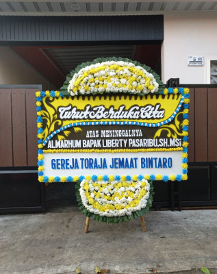 Papan Bunga Duka di Yatamo